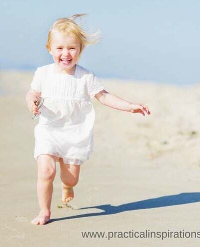 baby running on beach